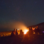 Our group from the Tokyo Snow Club enjoying the approach of summer with a bonfire under the starry sky.