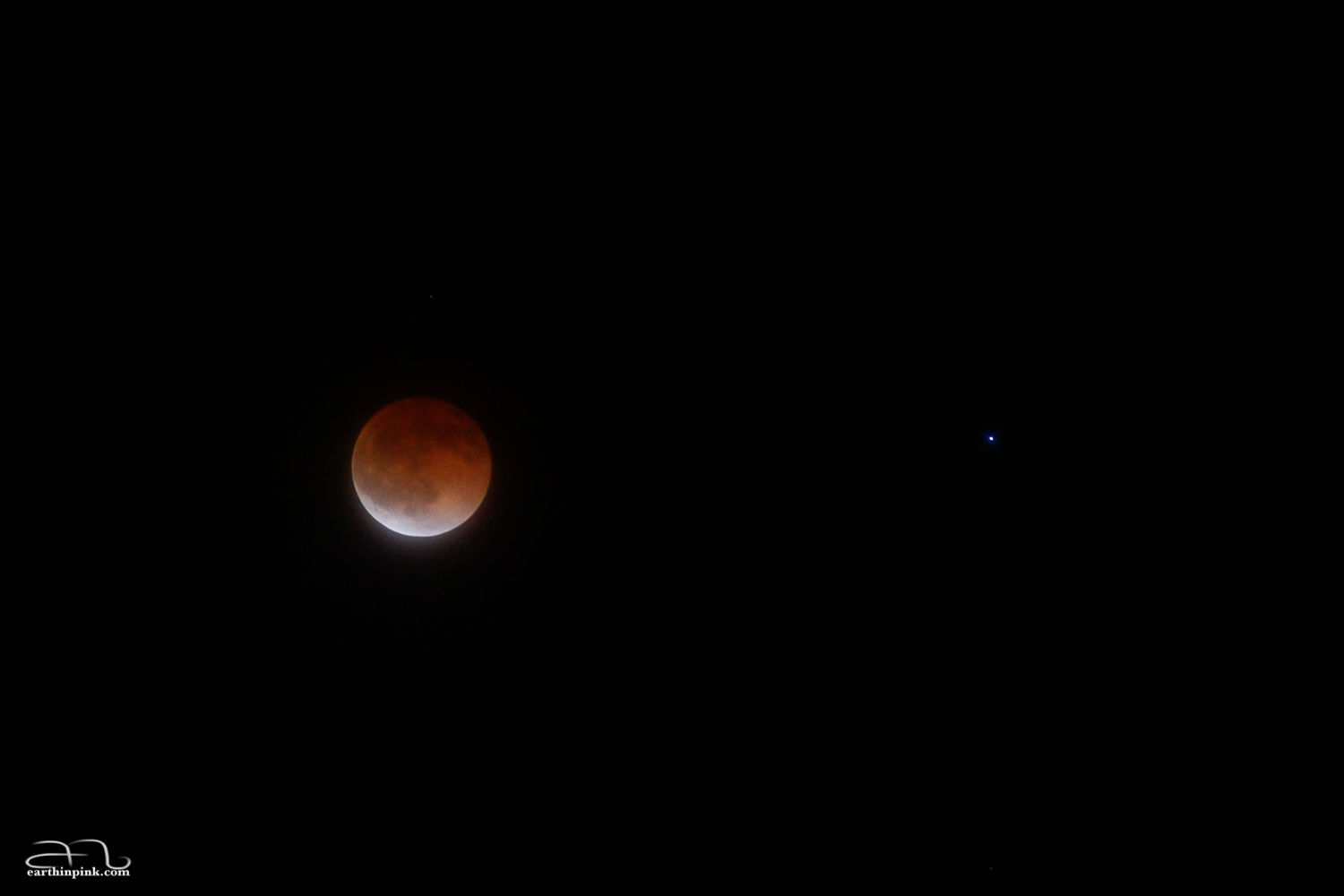 The total phase of the Lunar Eclipse on April 15, 2014. The bright star to the right is Spica in the constellation Virgo. Photographed by Norbi in Menlo Park, CA.