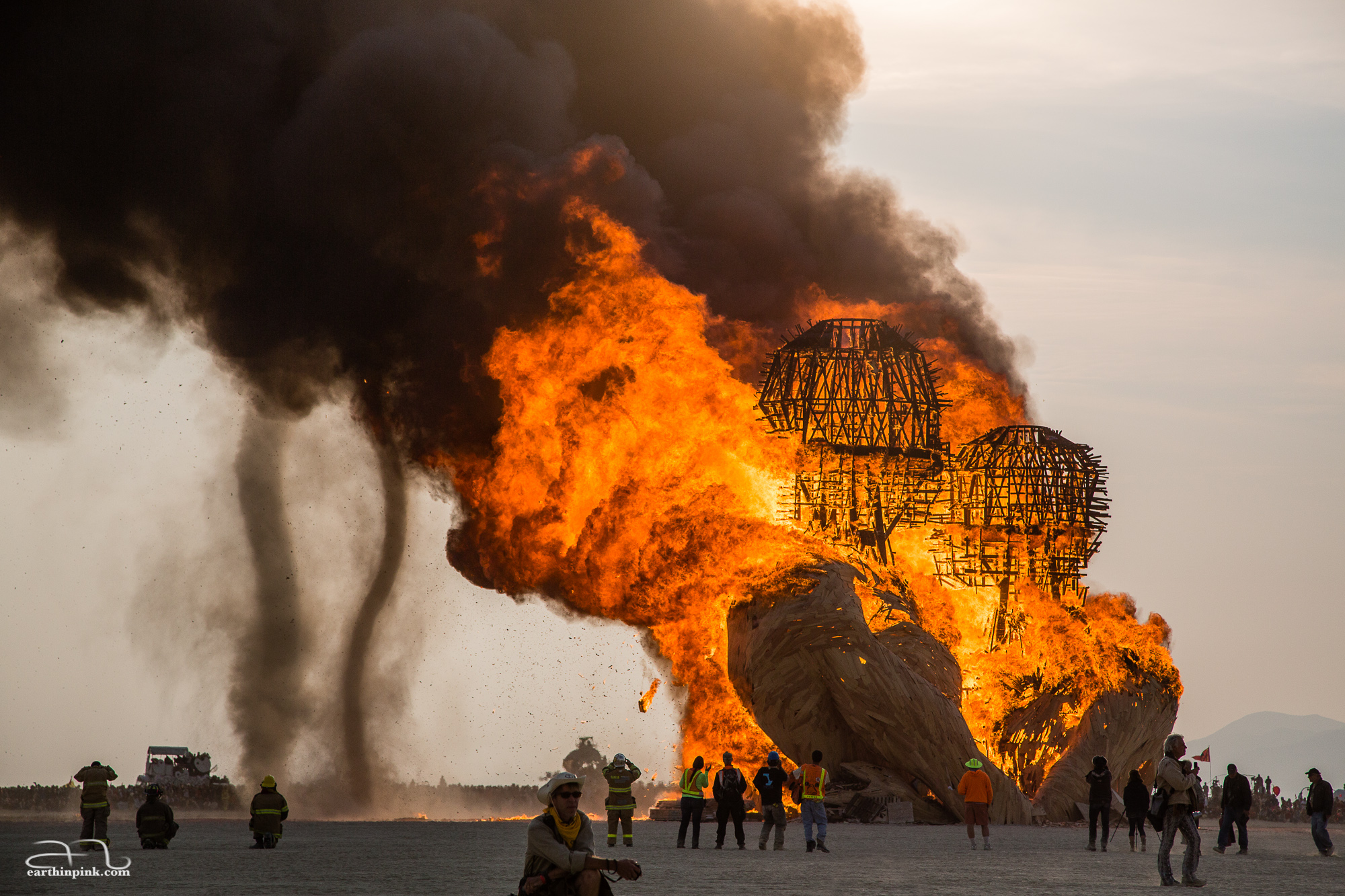 While most of the artwork is traditionally burned at night during this festival, the 70-foot wooden sculpture entitled 'Embrace' was set ablaze just after sunrise revealing the thick billowing smoke and many successive dust devils that could not have been seen otherwise in the dark.