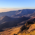 Sunrise at the summit of the Haleakala volcano (about 10,000 ft). In the distance, you can see the peaks of Mauna Kea and Mauna Loa on the Big Island of Hawaii.