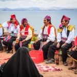 Drinks with the locals of Taquile Island on Lake Titicaca, Peru